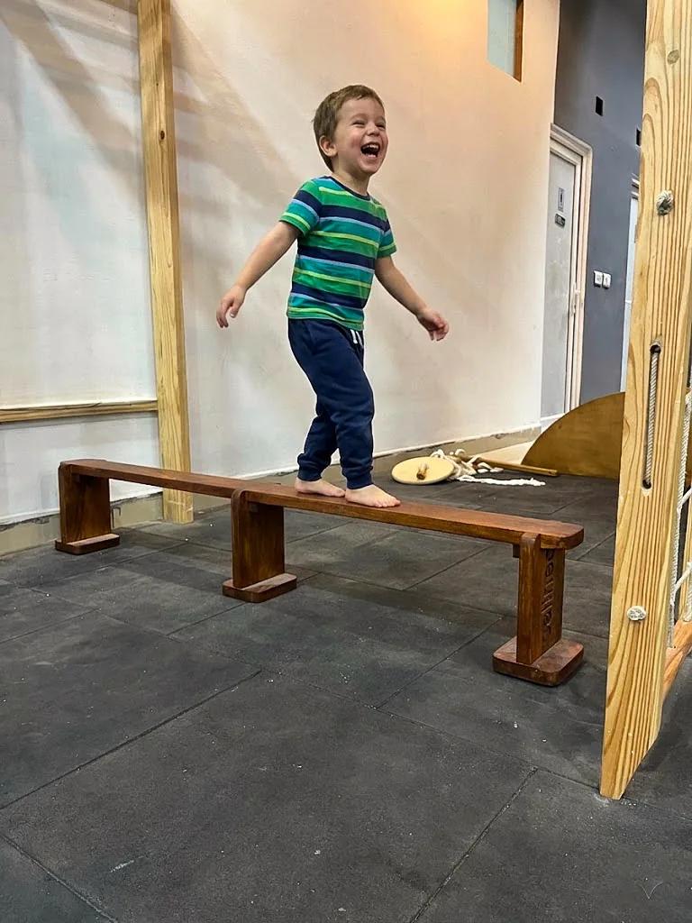 Kid Playing on Calineo Balancing Beam