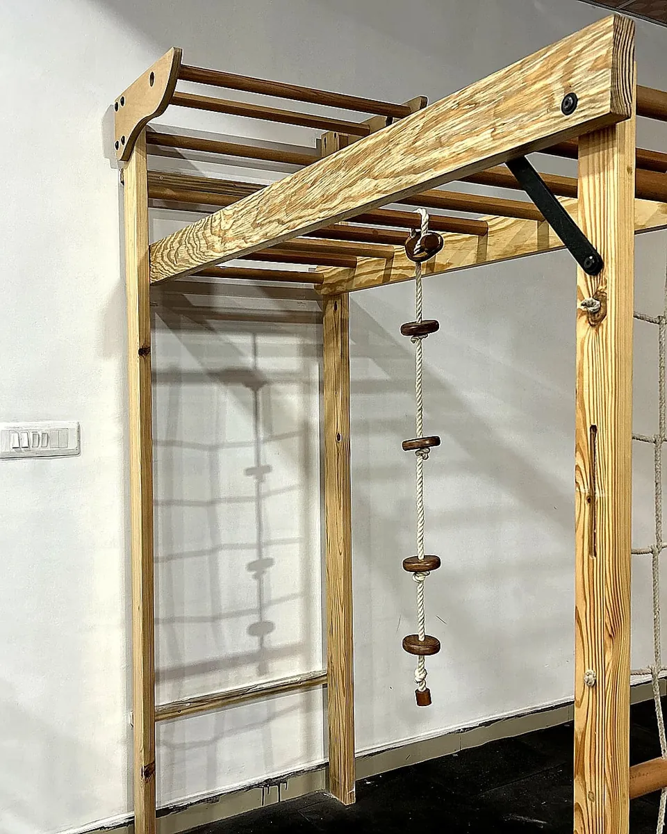Climb Rope hanging from wooden ladder frame